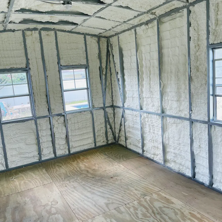 Closed-cell spray foam insulation applied to wall cavities in a residential project in Wellington